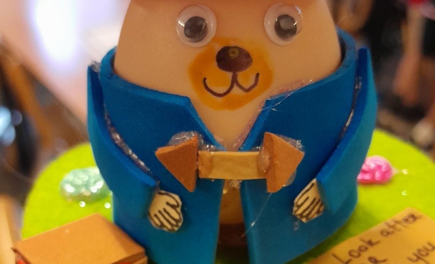 a picture of an egg dressed as Paddington Bear